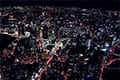 ヘリコプターで大阪上空から見る梅田駅周辺の夜景